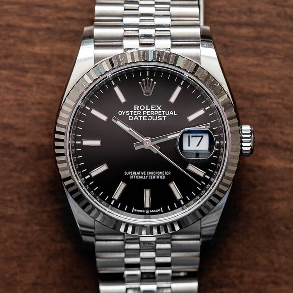 Rolex Datejust with a black dial, fluted bezel and Jubilee bracelet